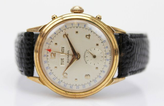 MENS RODANA GOLD PLATED DAY DATE WRISTWATCH: MENS RODANA GOLD PLATED DAY DATE WRISTWATCH Gold dial. Day and date with hand date. Inset second hand dial. Alligator look Leather strap. Size: 28mm dial Condition: VGC, strap loose Est.$150-250