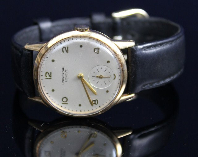 MENS UNIVERSAL 14K GOLD CASE WRIST WATCH: MENS UNIVERSAL 14K GOLD CASE WRIST WATCH A 17 jewel, 14K yellow gold, wrist watch by Universal, Geneve. Case # 1229827, 51201. Recessed second dial. Recently serviced. Replaced leather strap. Weight: 