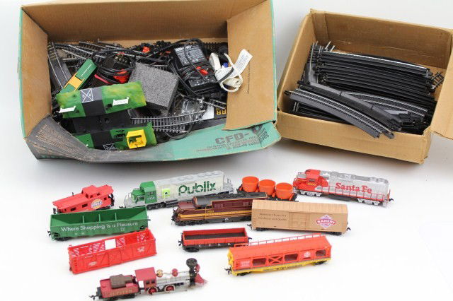 LARGE LOT OF TOY TRAINS AND TRACK: Large lot of toy trains and track. Mixed and varied. E-Z gauge. All untested. Includes Boston and Main 1553 and Santa Fe 3500 loco, 4 pieces from the Publix 65th Anniversary set.