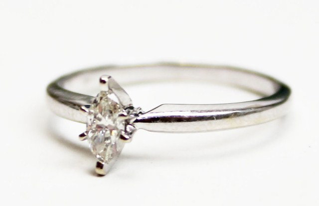 14K GOLD .25ct. MARQUISE DIAMOND SOLITAIRE RING: 14K GOLD .25ct. MARQUISE DIAMOND SOLITAIRE RING A simple and elegant 14k white gold .25ct. marquise diamond solitaire ring. Possessing a prong-set center .25ct. marquise diamond of SI2 clarity and H c