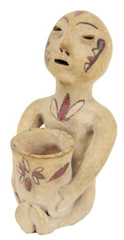 PUEBLO RAIN GOD MADE OF CLAY: PUEBLO RAIN GOD MADE OF CLAY This figure is from Tesuque, New Mexico, circa early 1900s. Rain Gods were popular figurals in Pueblo culture. This deity is holding a large vase decorated with red, yello