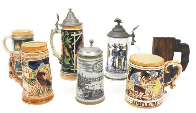 LOT OF GERMAN WOOD & STONEWEAR STEINS PLUS OTHERS: LOT OF GERMAN WOOD & STONEWEAR STEINS PLUS OTHERS Comprising; Carved wood Black Forest stein of 7 inches. A Frankfurt stein with lid. A colored stone wear stein with lid. 11 inches. A porcelain stein 