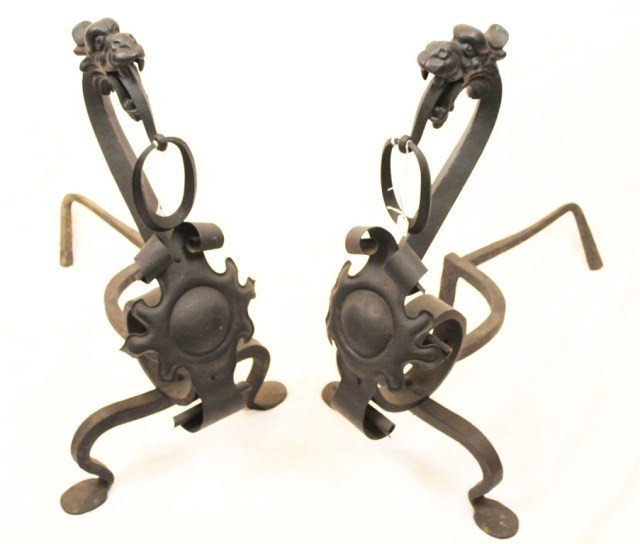 PAIR OF CAST IRON DRAGON FIRE GUARD: PAIR OF CAST IRON DRAGON FIRE GUARD Fire guard or "fire dogs" cast of iron in the shape of a dragon. One dragon at each end of the guard completes this decorative piece. Size: 27" tall Condition: VGC 