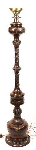 TALL DECORATIVE ASIAN MOTIF FLOOR LAMP: TALL DECORATIVE ASIAN MOTIF FLOOR LAMP Incorporating ornate relief art of various animals: cranes, scissor-tails, foo dogs, and more. Mid 20th century decorative piece. Size: 71" tall with bulb Condit