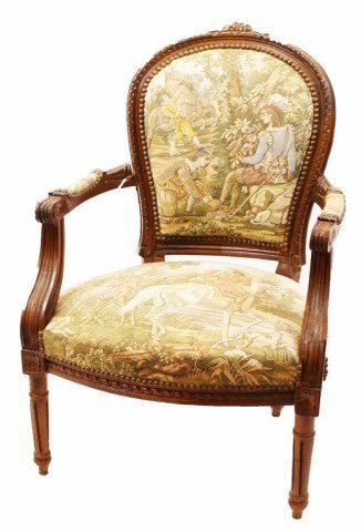 WOODEN ARMCHAIR W/ FRENCH SCENE OF THE 1800S: WOODEN ARMCHAIR W/ FRENCH SCENE OF THE 1800S Seat cushion and back depict a scene of French citizens enjoying a day out on the horses. The subjects are dressed in attire associated with the 1800s. Cre