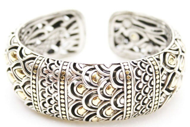 JOHN HARDY STERLING & 18K NAGA BANGLE BRACELET: JOHN HARDY STERLING & 18K NAGA BANGLE BRACELET An exemplary piece of John Hardy sterling silver and 18K yellow gold craftsmanship. This bangle bracelet is the essence of intricate and ornate design. T