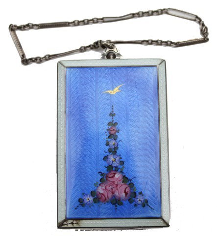 STERLING SILVER GUILLOCHE BLUE ENAMELED COMPACT: STERLING SILVER GUILLOCHE BLUE ENAMELED COMPACT A beautiful 1920's FM Company vintage ladies sterling silver guilloche enamel compact in dark blue color with pink and purple floral enamel design to th