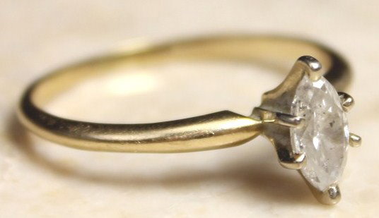 LADIES 14K GOLD .5CT MARQUISE CUT DIAMOND RING: LADIES 14K GOLD .5CT MARQUISE CUT DIAMOND RING 14k yellow gold band with a single marquise cut diamond of .5ct. Color K. Clarity VS2. Weight: 2g Size: 8 Condition: VGC Lot: 15548a