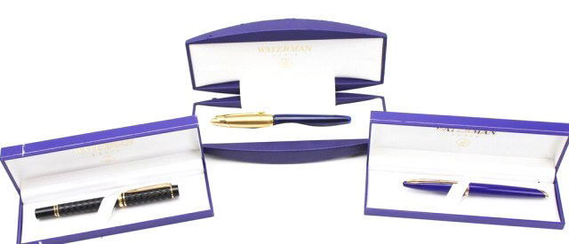 LOT OF 3 WATERMAN FOUNTAIN PENS: LOT OF 3 WATERMAN FOUNTAIN PENS Expert II pen in black lacquer, two-toned nib marked "Ideal", 18K, and "F". Carene pen in abyss blue with palladium plated trims, 18K nib marked "M". Edson pen in sapph
