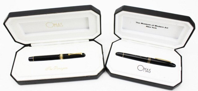 LOT OF 2 OMAS FOUNTAIN PENS: PARAGON & MOMA NY: LOT OF 2 OMAS FOUNTAIN PENS: PARAGON & MOMA NY One of Omas' elite piston fountain pens, "The Paragon", features a gold colored band and clip. The nib is marked 18K, two-toned, and "F". The tip of the 