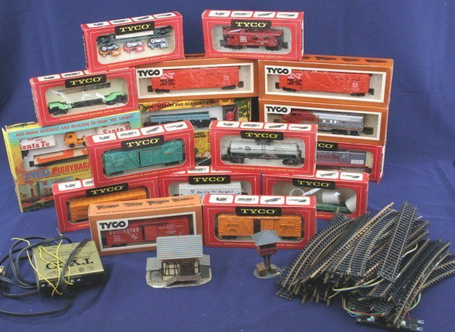 MIXED LOT OF TOY TRAINS MOSTLY TYCO: MIXED LOT OF TOY TRAINS MOSTLY TYCO A variety of stock trains, track, and electronics, some are boxed. All are untested. Size: HO scale Condition: Play worn, generally VG Lot: 15829