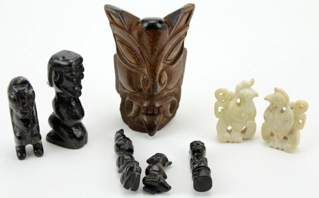 LOT OF 8 NEPHRITE JADE CARVINGS: LOT OF 8 NEPHRITE JADE CARVINGS A brown nephrite votive mask some minor cracks. 5 Hongshan Culture brown/black nephrite Jade figures. A matching pair of carved white jade birds. Size: 2.5 to 6.5" Cond