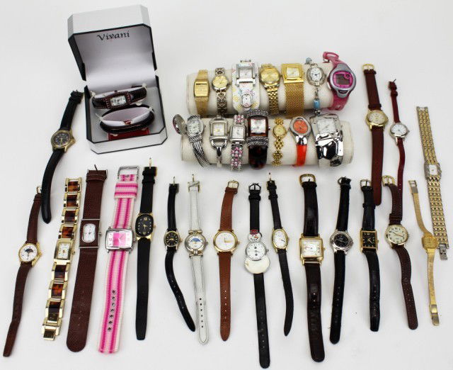 LOT OF 34 LADIES WRISTWATCHES: LOT OF 34 LADIES WRISTWATCHES Lot of 34 assorted ladies wristwatches, various makes and sizes. Featuring Timex, Guess, Fossil, Vivani, Muroya, Harve Benard, Seiko, Caravelle, Geneva, Ltd., Vernier and