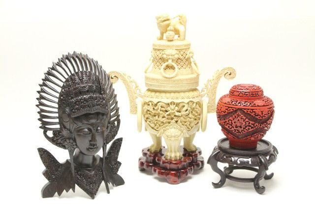 CINNABAR VASE, GUAN YIN BUST, COMPOSITE CENSER: CINNABAR VASE, GUAN YIN BUST, COMPOSITE CENSER Lot of 3 items. A carved and polished ebony bust/mask of a deity figure, possibly Guan yin. A Chinese cinnabar ginger jar and a large censer pressed from