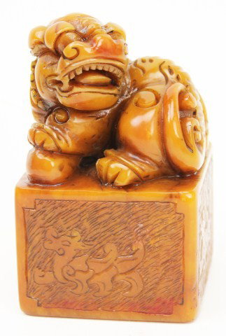 CHINESE SOAPSTONE DRAGON SEAL: CHINESE SOAPSTONE DRAGON SEAL A finely carved Chinese dragon seal made of soapstone. Incised dragon design to the sides. Size: 3.75" x 2.25" x 2.25" Condition: VGC Est. 300-600 Lot 18164