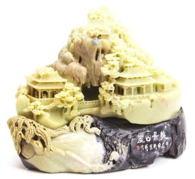 CHINESE JADE & SOAPSTONE CARVED VILLAGE SCENE: CHINESE JADE & SOAPSTONE CARVED VILLAGE SCENE Chinese carved jade and soapstone boulder of a village on a mountain side. Size: 7.5" tall x 9.5" wide Condition: VGC Est. 200-400 Lot 18165