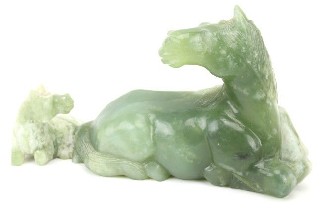 NEPHRITE STONE BOULDER CARVING OF 2 HORSES: NEPHRITE STONE BOULDER CARVING OF 2 HORSES Green nephrite boulder of a mare and foal. Size: 12" long x 6.75" tall Condition: VGC Est. 100-300 Lot 18177
