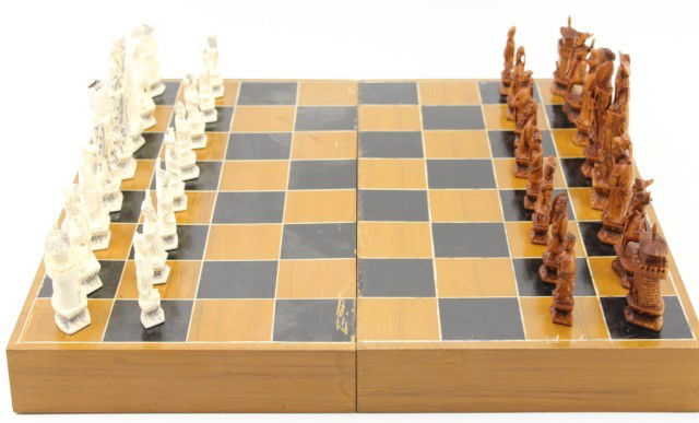 MAMMOTH IVORY CHINESE CHESS SET: MAMMOTH IVORY CHINESE CHESS SET Chinese chess set of 32 pieces each hand crafted from 40,000 year old mammoth ivory. Both king and queen of each side shows the sign for victory and have etched in desi