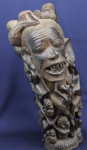 AFRICAN EBONY CARVED ANCESTRAL TREE OF LIFE: AFRICAN EBONY CARVED ANCESTRAL TREE OF LIFE African Ebony "Tree of Life" Totem carved from a single piece of ebony tree trunk and showing an ancestral figure covered in figures of climbing children. S