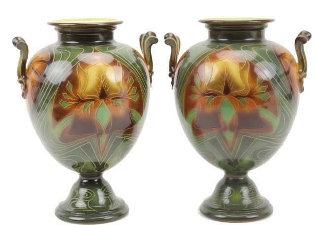 PAIR OF DECORATED ROYAL BONN GERMAN VASES: PAIR OF DECORATED ROYAL BONN GERMAN VASES A beautifully painted pair late 19th C. footed Royal Bonn vases. Hues of browns and green in color. Marked to bottom. Size: 12" Condition: VGC Est. 150-300 Lo