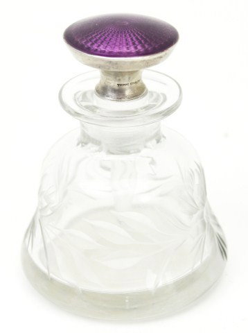 THOMAE STERLING GLASS PERFUME DECANTER: THOMAE STERLING GLASS PERFUME DECANTER Thomae Sterling glass decanter with floral design. The craftsmanship of Thomae is represented through the purple enamel topper. Size: 4" Condition: VGC Est. 75-1