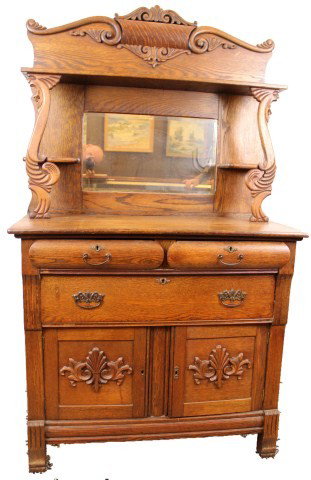 AMERICAN DARK OAK BUFFET WITH MIRRORED BACK: AMERICAN DARK OAK BUFFET WITH MIRRORED BACK Early 20th century American deep maple oak mirrored back buffet sideboard with drawers and cabinets. Size: 72 x 42" Est. 200-400 Lot 18324