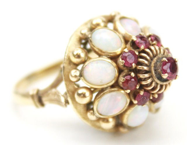 LADIES 14K GOLD OPAL & PINK TOPAZ RING: LADIES 14K GOLD OPAL & PINK TOPAZ RING Made of 14K yellow gold, this ring features oval cut opals and round pink topaz in its setting. The opals lie underneath a crown style arrangement of magnificent