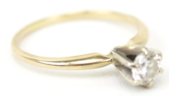 LADIES 14K GOLD DIAMOND SOLITAIRE ENGAGEMENT RING: LADIES 14K GOLD DIAMOND SOLITAIRE ENGAGEMENT RING A 14K yellow gold band with approximately a 0.33 round cut diamond prong set in 14K white gold. Diamond is approximately SI clarity and I color. Weigh
