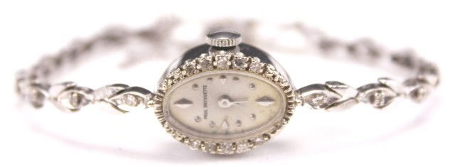 LADIES 14K WHITE GOLD BULOVA WATCH: LADIES 14K WHITE GOLD BULOVA WATCH Bulova 6 Jewel automatic movement in 14K white gold case with diamonds and 14K white gold band. Weight: 13.7g Condition: VGC Est. 300-500 Lot 18585
