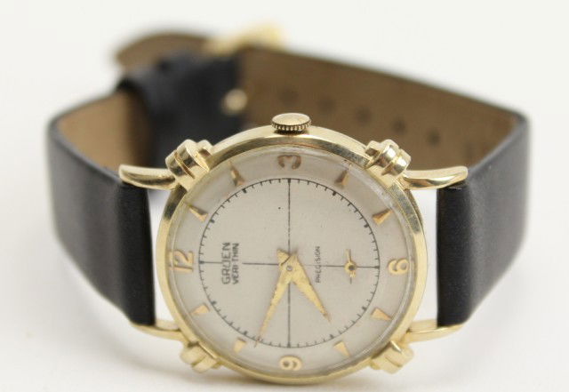 MENS 14K GOLD GRUEN VERI-THIN PRECISION WATCH: MENS 14K GOLD GRUEN VERI-THIN PRECISION WATCH A vintage 1950's men's Gruen Veri-Thin Precision wristwatch. 14K yellow gold case #M51711. 17 Jewel Swiss Movement #415. Gold markers & hands. Off-white d