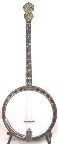 VINTAGE PARAMOUNT STYLE A 4 STRING TENOR BANJO: VINTAGE PARAMOUNT STYLE A 4 STRING TENOR BANJO A vintage tenor banjo. 19 frets with a total neck length of 22 inches, inlaid mother of pearl scrollwork. Solid body resonator back with original Paramou