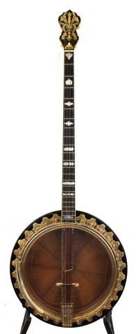 VINTAGE 4 STRING BANJO BY LYON & HEALY: VINTAGE 4 STRING BANJO BY LYON & HEALY A vintage Plectrum or standard banjo made by Lyon & Healy (1864-1940). 22 frets with a total neck length of 25 inches, inlaid mother of pearl scrollwork and scro