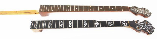 TWO BANJO NECKS - GIBSON & BACON & DAY: TWO BANJO NECKS - GIBSON & BACON & DAY Vintage banjo necks. A Gibson 21 fret with inlaid mother of pearl and Foliate carving. 25.5 inches total length, VGC. A Bacon & Day 21 fret with mother of pearl