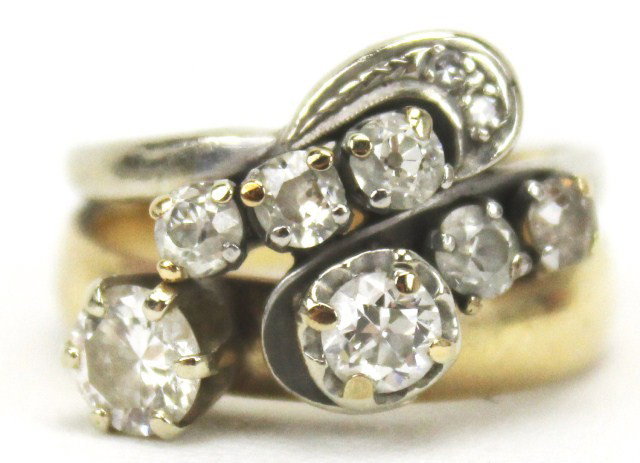 LADIES 14K GOLD DIAMOND COCKTAIL RING: LADIES 14K GOLD DIAMOND COCKTAIL RING A ladies 14K yellow gold diamond solitaire fused with a 14K white gold cocktail ring with 8 diamonds. Diamond solitaire is approximately 0.5 ct of SI-1 clarity an
