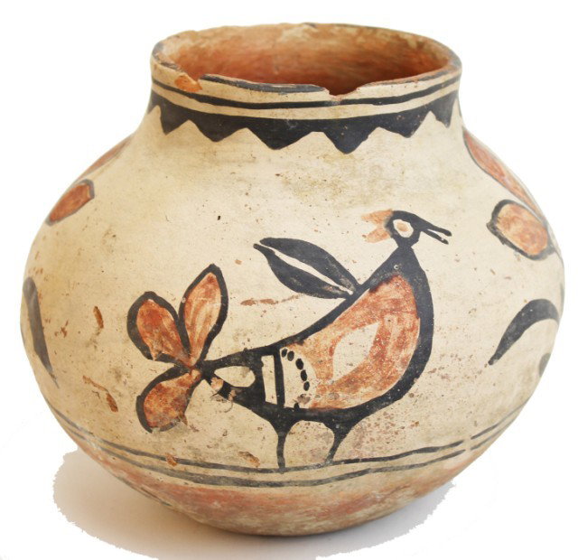 NATIVE AMERICAN POLYCHROME POT: NATIVE AMERICAN POLYCHROME POT Large size Native American clay pot bird and flower design appears to be a piece from the ZIA tribe. One side of paint is rubbed off and minor chips to the rim. Size: 7.