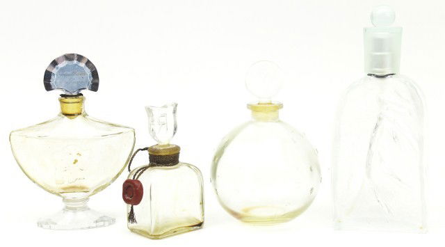 4 COLLECTIBLE GLASS PERFUME BOTTLES: 4 COLLECTIBLE GLASS PERFUME BOTTLES To include the following bottles: 1.7 fluid ounce Rochas - French molded frosted glass with nude woman & pump top, 4.2 fluid ounce by Baccarat for Guerlain - French