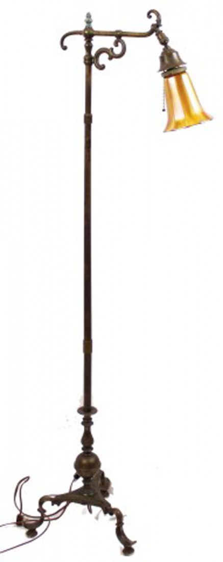 19th C. BRASS FLOOR LAMP W/ LUSTRE ART & QUEZAL SHADE: 19th C. BRASS FLOOR LAMP W/ LUSTRE ART & QUEZAL SHADE 19th C. Brass floor tripod lamp with pull chain and tassel fitted with Gold Lustre Art Glass Shade, also present is Quizele Art Glass Shade. Lamp 