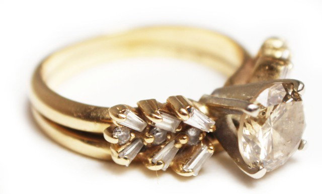 LADIES 14K GOLD SOLITAIRE DIAMOND ENGAGEMENT RING: LADIES 14K GOLD SOLITAIRE DIAMOND ENGAGEMENT RING 1.21 ct diamond solitaire of approximately I-1 clarity and fancy light yellow color. Prong set in 14K yellow gold and soldered to a 14K yellow gold an