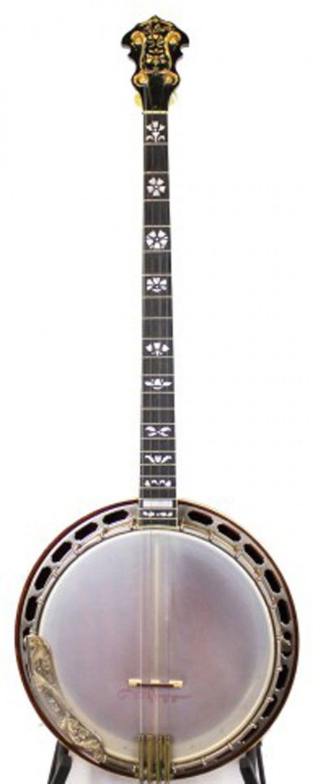 VINTAGE GIBSON MASTERTONE 4 STRING BANJO: VINTAGE GIBSON MASTERTONE 4 STRING BANJO - PIECED TOGETHER A vintage Plectrum or standard banjo. 22 frets with a total neck length of 25.5 inches, inlaid mother of pearl floral scrollwork. Solid body