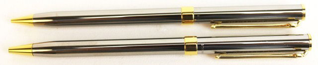 TIFFANY & CO RUTHENIUM T-CLIP PEN & PENCIL SET: TIFFANY & CO RUTHENIUM T-CLIP PEN & PENCIL SET Tiffany & Co ruthenium pen and pencil set. Gold colored T-clip. Ball point pen and twist mechanical pencil. Contained in Tiffany cloth holder. Condition: