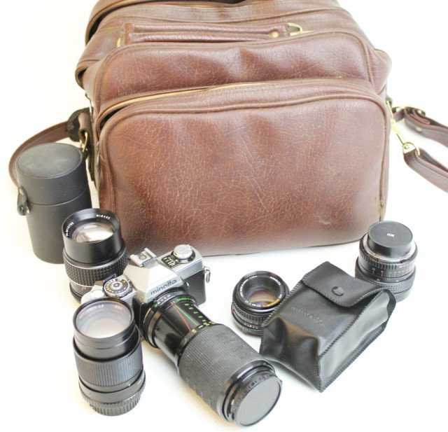 MINOLTA XG1 35MM CAMERA WITH 5 LENSES AND FLASH: MINOLTA XG1 35MM CAMERA WITH 5 LENSES AND FLASH Minolta XG1 35mm camera. With 5 different lenses; MD Rokkor-X 50mm 1:1.7, Samigon 28mm 1:2.8, CPC auto 135mm 1:2.8, Mirage 135mm 1:2.8 (in a leather cas