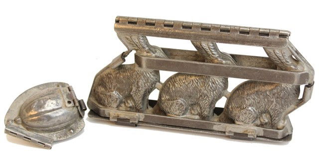 2 VINTAGE GERMAN CHOCOLATE MOLDS: 2 VINTAGE GERMAN CHOCOLATE MOLDS An Anton Reiche German chocolate mold. The mold makes three rabbits. 10" long and 5" tall. The second mold is by T.C. Weygandt and makes a Jack o' lantern. 3" tall. Co