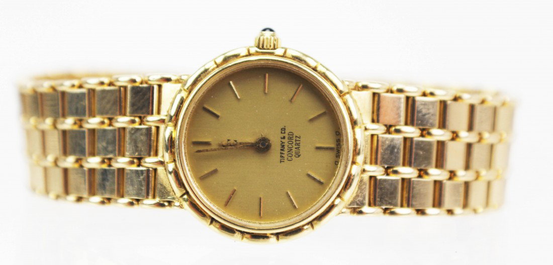 LADIES 18K GOLD TIFFANY & CO CONCORD WATCH: LADIES 18K GOLD TIFFANY & CO CONCORD WATCH Tiffany & Co 18K yellow gold wrist watch. Concord quartz movement. Back of case is marked "5061262683" above "498959". Weight: 51.7g total. Condition: VGC, n