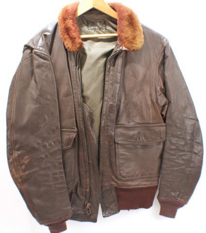 UNIFORM - US AVIATOR G1 TYPE LEATHER JACKET: UNIFORM - US AVIATOR G1 TYPE LEATHER JACKET Leather flight jacket, type G-1. Monarch Tag is unreadable. Approx Size 40. Condition: Light wear. Fair/Good. EST. 100-200