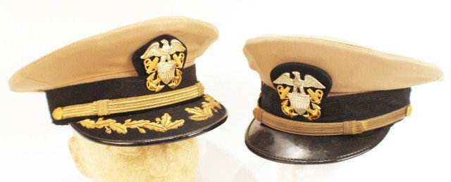HEADGEAR - WW2 US NAVY OFFICERS VISOR CAP LOT OF 2: HEADGEAR - WW2 US NAVY OFFICERS VISOR CAP LOT OF 2 Light tan dress hats with bi-metal badges. No moth, slight staining. Will fit head size of approx 21" & 23" Condition: VG or better EST. 100-200