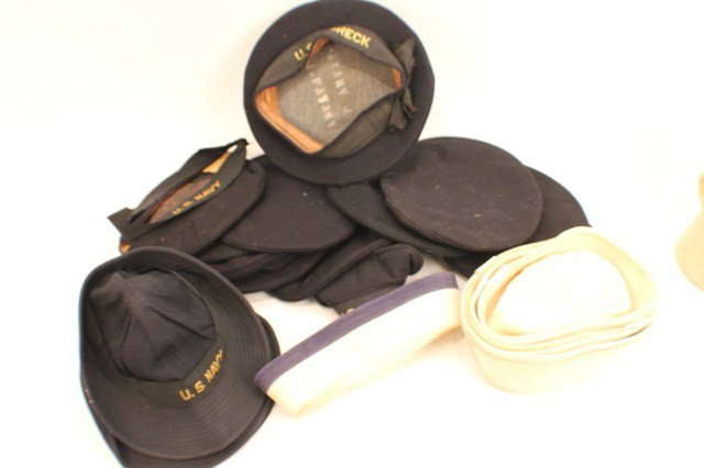 HEADGEAR - A SELECTION OF US NAVY HATS: HEADGEAR - A SELECTION OF US NAVY HATS A good selection of US navy working dress hats. 7 white, 3 soft blue and 11 wool blue hats. Most have tallys in place. Condition: Fair/good EST. 100-200
