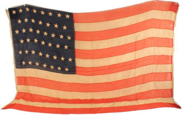 45 STAR AMERICAN FLAG: 45 STAR AMERICAN FLAG 1896-1908. A good example of the standard flag of the period. Hessian gauze material. 5' x 8'. Condition: Good, some wear and holes EST. 100-200