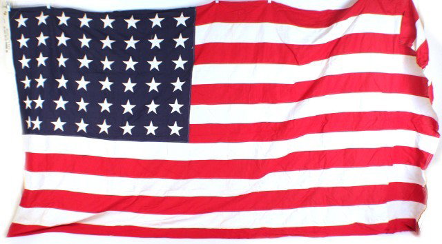 LARGE 48 STAR AMERICAN FLAG: LARGE 48 STAR AMERICAN FLAG 1912-1959. A good example of the standard flag of the period. Sewn example, Hessian gauze material. 5' x 9.5'. Condition: Good, little sign of use EST. 75-150