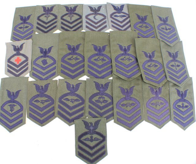 22 US NAVY EMBROIDERED CPO ARM PATCHES: 22 US NAVY EMBROIDERED CPO ARM PATCHES A selection of black embroidered arm patches, all to Chief Petty Officers rate, mainly removed from uniform. White dress backings. 22 in total, a good mix of tra