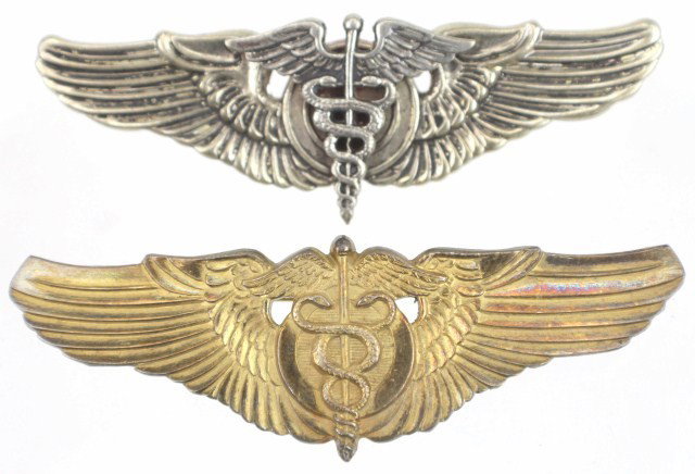 2 US AVIATORS WINGS - FLIGHT NURSE: 2 US AVIATORS WINGS - FLIGHT NURSE Gilt sterling silver medics wings and a white metal version Size: 3" Condition: Very minor wear EST. 50-100